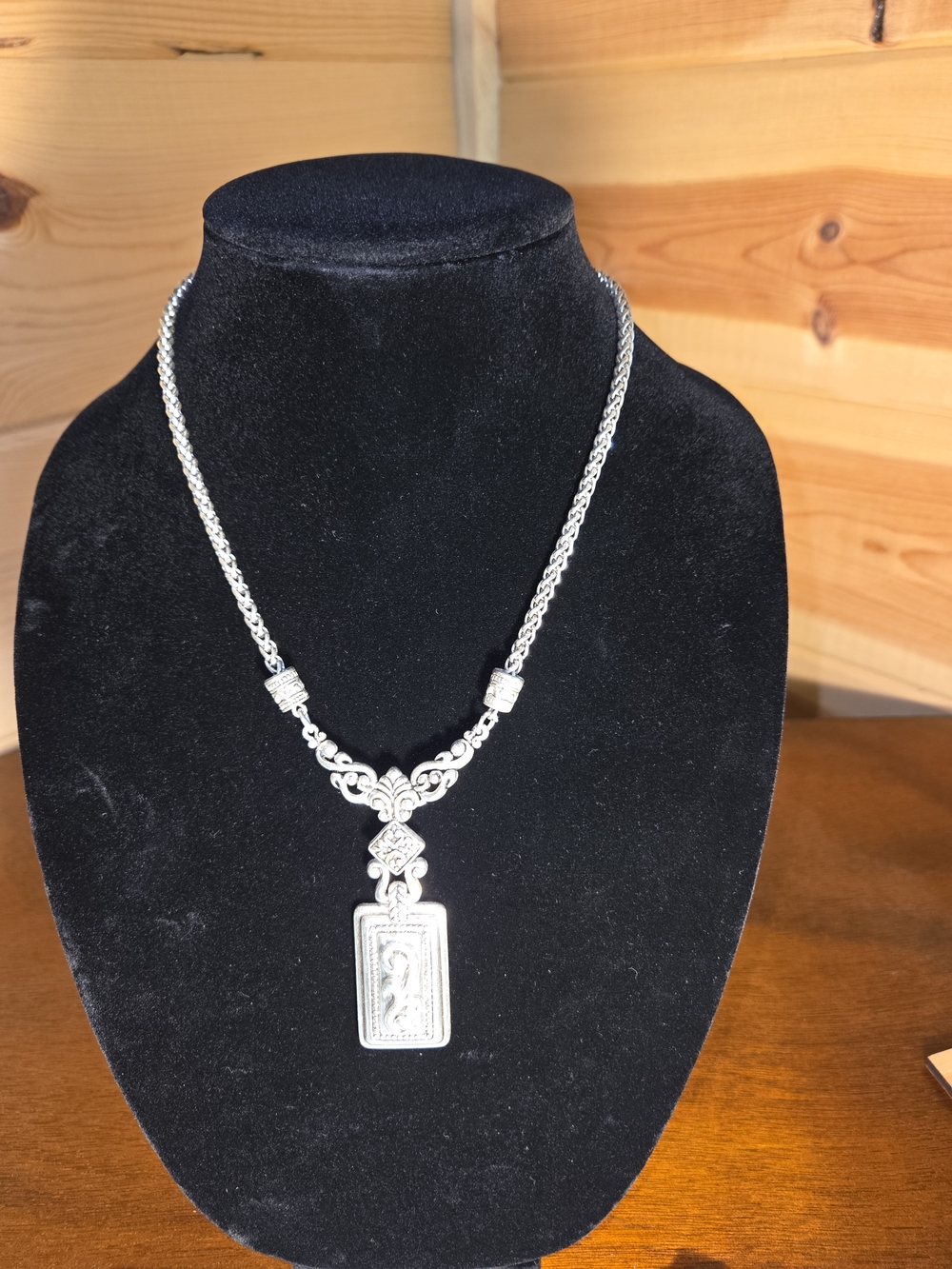 Ornate Silver Pendant Necklace with Detailed Rectangular Medallion